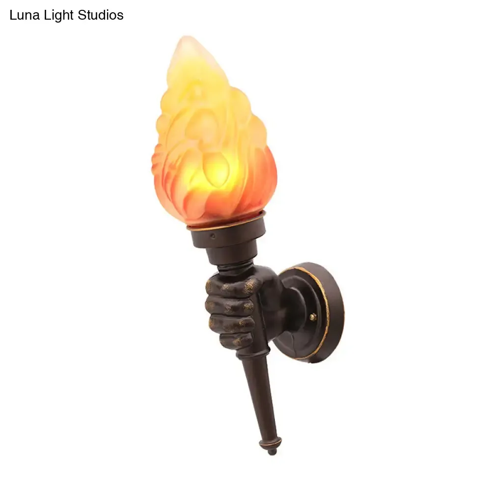 Black Wall Sconce with Amber Glass Torch and Hand Decor - Single Bulb Mount Light